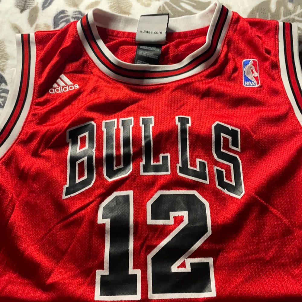 Used youth Chicago Bulls jersey by Adidas.